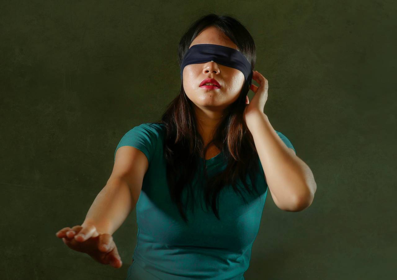 Blind folded asian