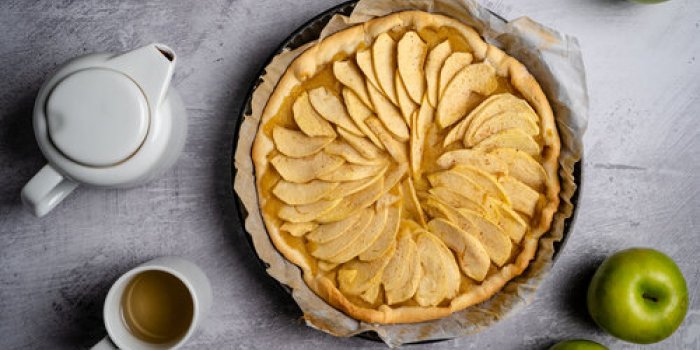 flat,lay,shot,of,french,apple,tart,with,tea,cup