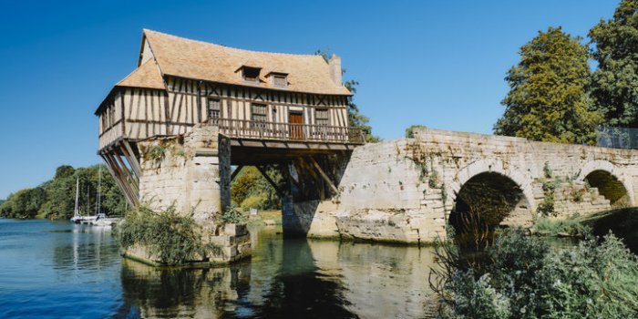 the old mill on the seine river at vernon, normandy, france