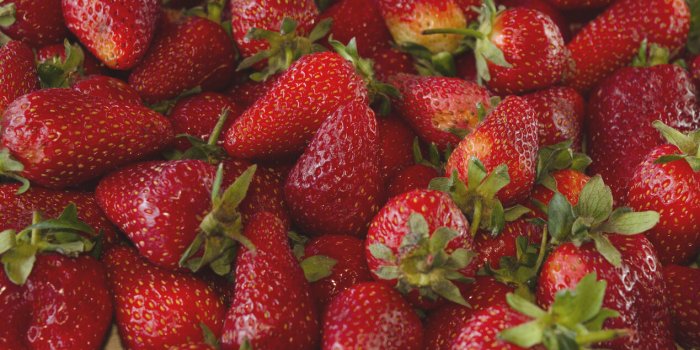 background of red and fresh strawberries together