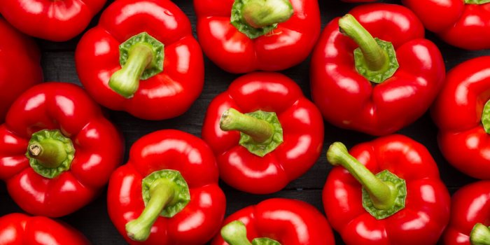 red peppers full frame on black background