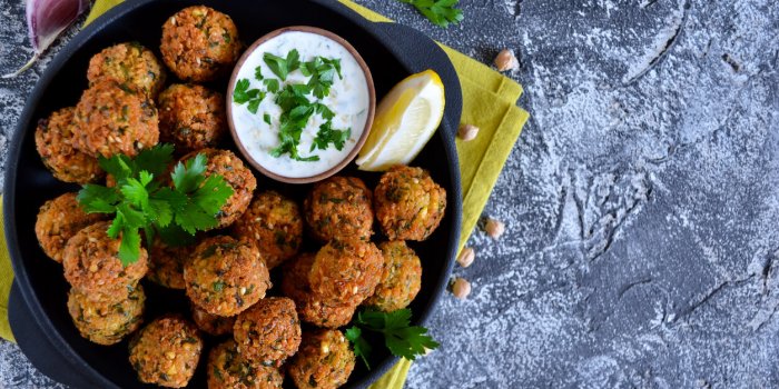 falafel - deep fried balls of ground chickpeas with tahini sauce from