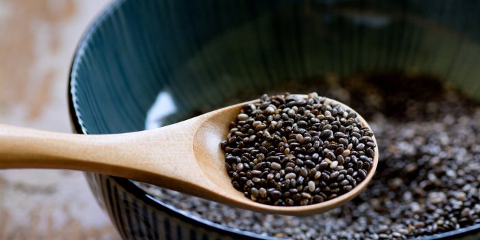 nutritious chia seeds on a wooden spoon, superfood