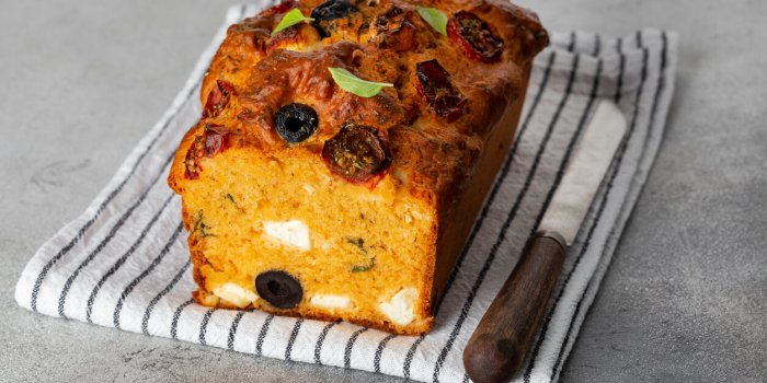 savoury cake with cherry tomatoes, olives and feta cheese