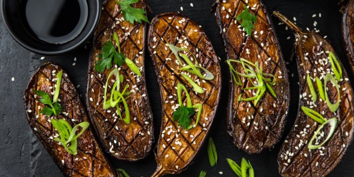 glazed grilled eggplants served with sesame seeds and green onion