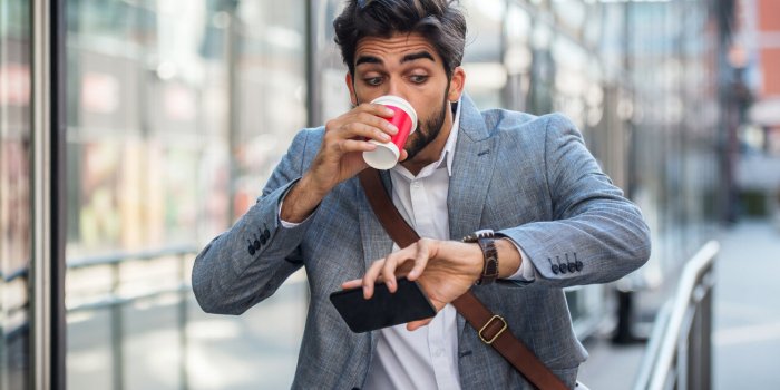 never don't be late on business meeting worried businessman looking at his watch on the way to office business, lifestyle...