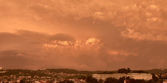 spectacular yellow sunrise from the dust of the sahara in vigo, spain