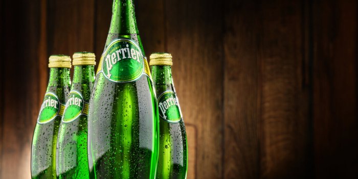 poznan, poland - june 24, 2016 perrier is a french brand of natural bottled mineral water sold worldwide and available i...