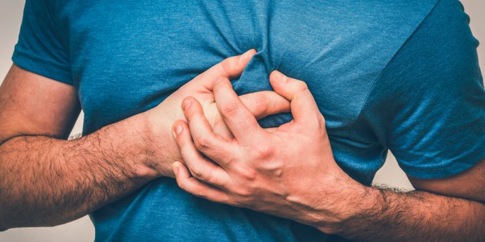 man having chest pain, heart attack - body pain concept