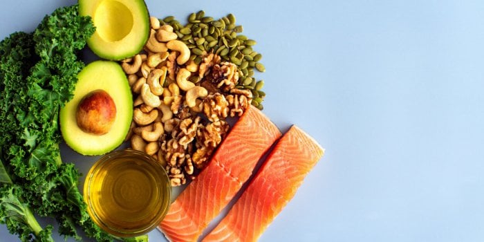 a variety of healthy foods like fish, nuts, seeds, fruit, vegetables, and oil rich in omega-3 nutrients